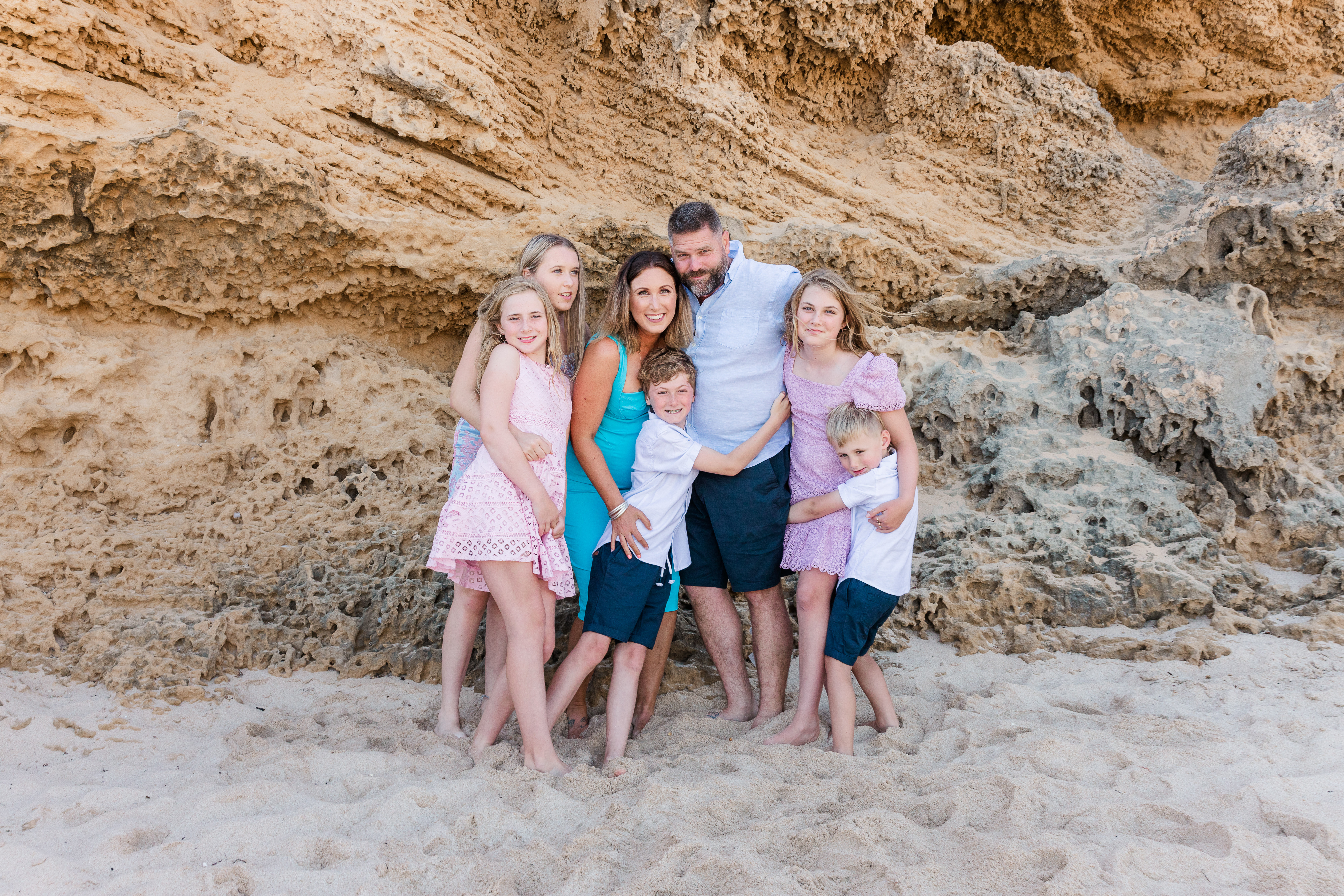 Family at beach with colour pop outfits