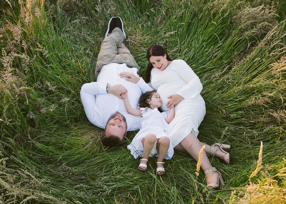 Maternity wardrobe — white gown in nature
